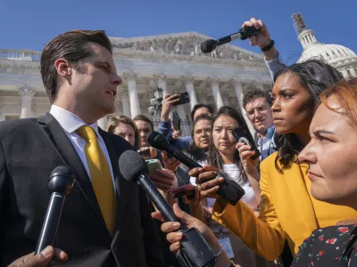 Rep. Matt Gaetz, R-Fla., left, one of House Speaker Kevin McCarthy's harshest critics, answers questions from members of the media after speaking on the House floor, at the Capitol in Washington, Monday, Oct. 2, 2023. Gaetz has said he plans to use a procedural tool called a motion to vacate to try and strip McCarthy of his office as soon as this week. (AP Photo/Jacquelyn Martin)