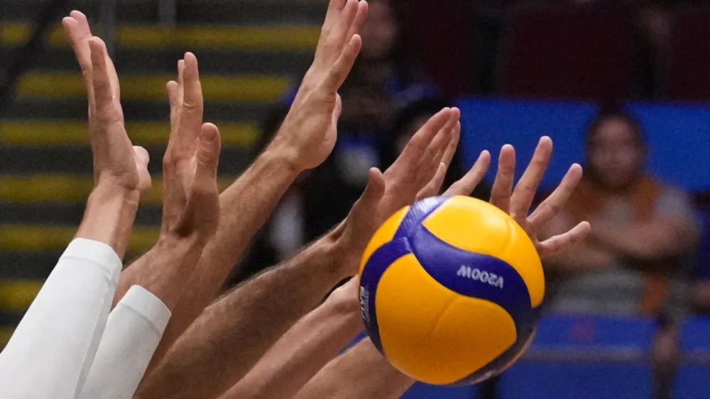 Italian men's team blocks the ball from Canada team during their game at the Men's Volleyball Nations League leg in Manila, Philippines on Thursday July 6, 2023. (AP Photo/Aaron Favila)