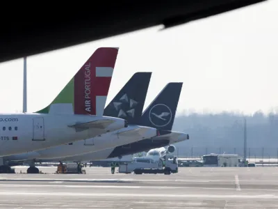 Airplanes are seen on the tarmac the day before VERDI union called airport workers at Frankfurt, Munich, Stuttgart, Hamburg, Dortmund, Hanover and Bremen airports to go on a 24-hour strike on Friday, at the Munich International Airport, Germany, February 16, 2023. REUTERS/Leonhard Simon