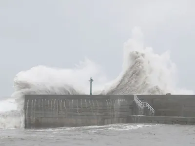 Waves break against the protecting walls of the Fugang Fishing Harbour as Typhoon Koinu moves past the southern tip of Taiwan, in Taitung, Taiwan October 5, 2023. REUTERS/Carlos Garcia Rawlins