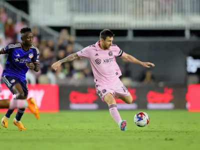 Oct 7, 2023; Fort Lauderdale, Florida, USA; Inter Miami CF forward Lionel Messi (10) dribbles the ball against FC Cincinnati midfielder Obinna Nwobodo (5) during the second half at DRV PNK Stadium. Mandatory Credit: Sam Navarro-USA TODAY Sports