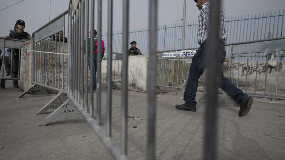 Israeli Border Police officers secure a checkpoint used by Palestinians to cross from the West Bank into Jerusalem, for the first Friday prayers in the Muslim holy month of Ramadan at the Al Aqsa mosque compound, Qalandia Israeli army checkpoint, west of Ramallah, Friday, April 8, 2022. (AP Photo/Nasser Nasser)