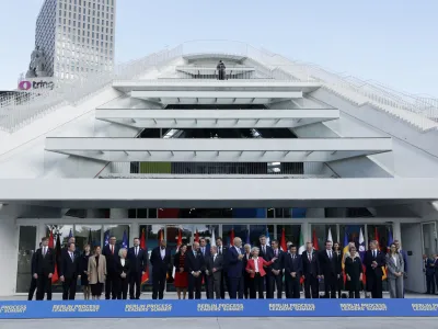 Leaders from EU and Western Balkans countries stand for a family photo in front of Pyramid Hall after Berlin Process Leaders' Summit in Tirana, Albania, Monday, Oct. 16, 2023. Leaders from the European Union and the Western Balkans hold a summit in Albania's capital to discuss the path to membership in the bloc for the six countries of the region. (AP Photo/Franc Zhurda)