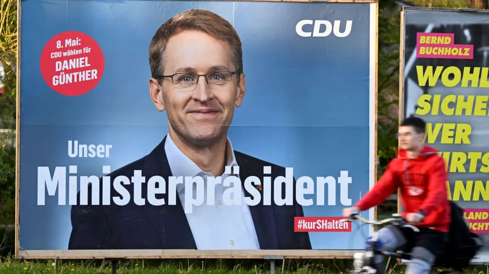 An election poster for the upcoming state elections on May 8 shows Schleswig Holstein's Prime Minister and Christian Democratic (CDU) top candidate Daniel Guenther in Elmshorn, Germany, May 3, 2022. REUTERS/Fabian Bimmer