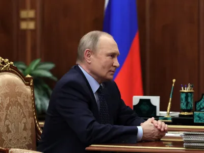 Russian President Vladimir Putin listens during a meeting in the Kremlin in Moscow, Russia, Friday, May 6, 2022. (Mikhail Klimentyev, Sputnik, Kremlin Pool Photo via AP)