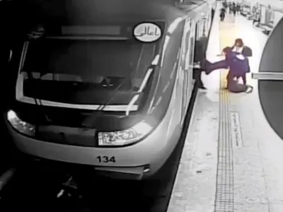 FILE - In this image from surveillance video aired by Iranian state television, women pull 16-year-old Armita Geravand from a train car on the Tehran Metro in Tehran, Iran, Sunday, Oct. 1, 2023. The Iranian teenage girl injured weeks ago in a mysterious incident on Tehran's Metro while not wearing a head scarf has died, Iranian state media reported Saturday, Oct. 28.(AP Photo/Iranian state television, File)