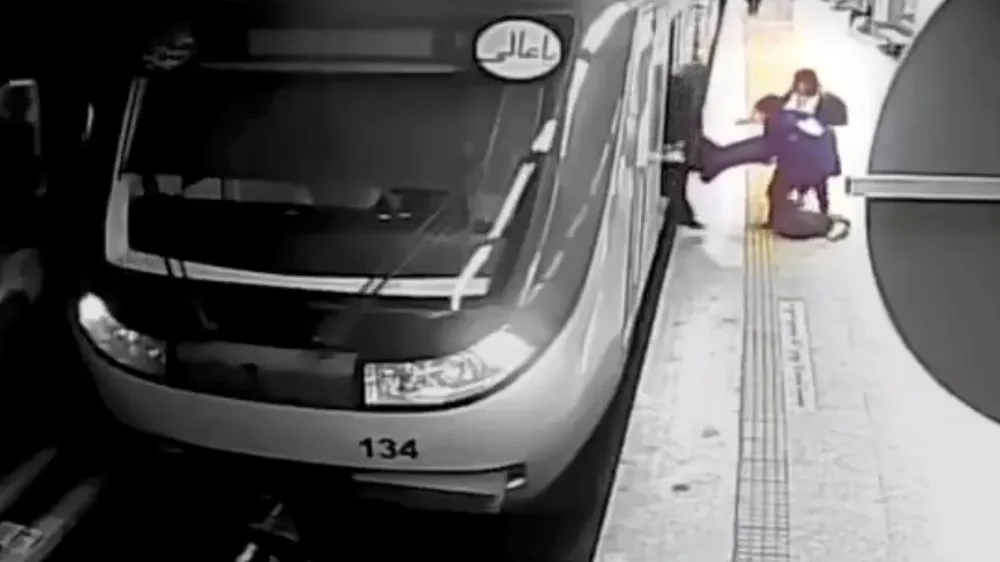 FILE - In this image from surveillance video aired by Iranian state television, women pull 16-year-old Armita Geravand from a train car on the Tehran Metro in Tehran, Iran, Sunday, Oct. 1, 2023. The Iranian teenage girl injured weeks ago in a mysterious incident on Tehran's Metro while not wearing a head scarf has died, Iranian state media reported Saturday, Oct. 28.(AP Photo/Iranian state television, File)