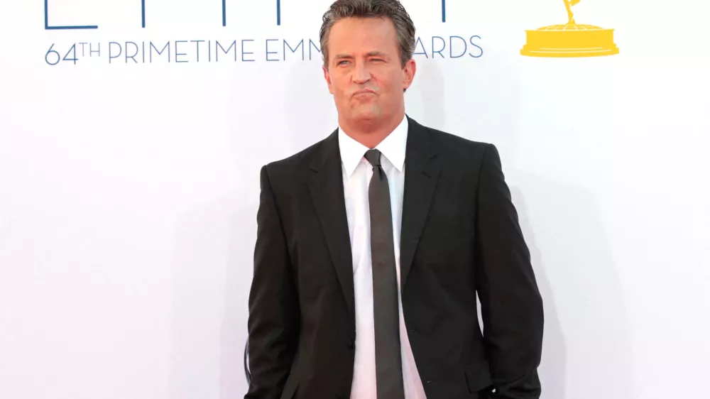 FILE PHOTO: Actor Matthew Perry arrives at the 64th Primetime Emmy Awards in Los Angeles September 23, 2012. REUTERS/Mario Anzuoni/File Photo