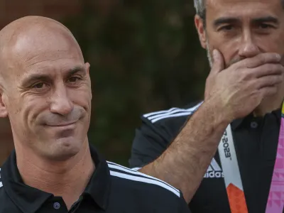 FILE - President of Spain's soccer federation, Luis Rubiales, left, stands next to Spain Head Coach Jorge Vilda after their World Cup victory at La Moncloa Palace in Madrid, Spain, Tuesday, Aug. 22, 2023. FIFA has banned ousted former Spanish soccer federation president Luis Rubiales from the sport for three years. He was judged for misconduct at the Women's World Cup final where he forcibly kissed a player on the lips at the trophy ceremony. FIFA did not publish details of the verdict reached by its disciplinary committee judges. (AP Photo/Manu Fernandez, File)