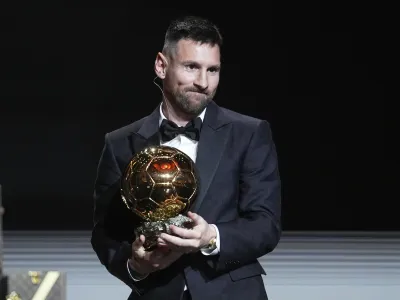 Inter Miami's and Argentina's national team player Lionel Messi receives the 2023 Ballon d'Or trophy during the 67th Ballon d'Or (Golden Ball) award ceremony at Theatre du Chatelet in Paris, France, Monday, Oct. 30, 2023. (AP Photo/Michel Euler)