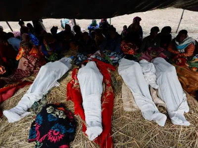  SENSITIVE MATERIAL. THIS IMAGE MAY OFFEND OR DISTURB  Family members sit next to the bodies of people who died during an earthquake in Jajarkot, Nepal November 5, 2023. REUTERS/Navesh Chitrakar