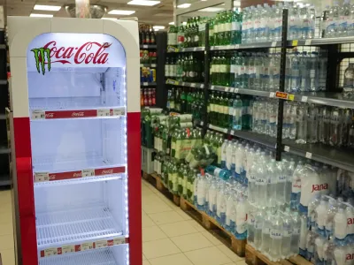 An empty CocaCola refrigerator is seen at a grocery shop in Zagreb, Croatia, Wednesday, Nov. 8, 2023. Authorities in Croatia on Wednesday recommended people drink only tap water as they investigated reports of several cases of people getting sick and suffering injuries allegedly after consuming bottled beverages. They did not say which products were being withdrawn, but photos on social media from shops suggested they were Coca-Cola brands. (AP Photo/Darko Bandic)