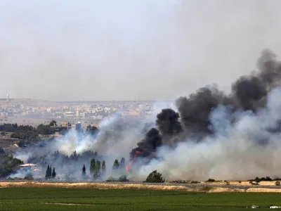 ﻿Smoke rises from a fire as a result of fighting in the the Syrian village of Quneitra near the border with Israel, as seen from an observatory near the Quneitra crossing, Thursday, June 6, 2013. Syrian rebels on Thursday captured a crossing point along a cease-fire line with Israel in the contested Golan Heights, a development that could deepen Israeli concerns over the growing role of Islamic radicals in the civil war near its northern frontier.(AP Photo/Sebastian Scheiner)