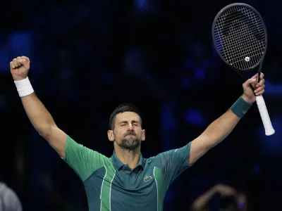 Serbia's Novak Djokovic celebrates after winning the singles tennis match against Denmark's Holger Rune, of the ATP World Tour Finals at the Pala Alpitour, in Turin, Italy, Monday, Nov. 13, 2023. (AP Photo/Antonio Calanni)