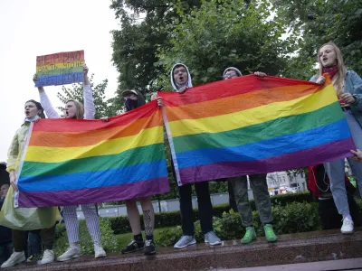 FILE - LGBT activists wave their flags during a rally to cancel the results of voting on amendments to the Constitution in Moscow, Russia, Wednesday, July 15, 2020. The Russian Justice Ministry says it has filed a lawsuit with the country's Supreme Court to outlaw the LGBTQ "international public movement" as extremist. (AP Photo, File)