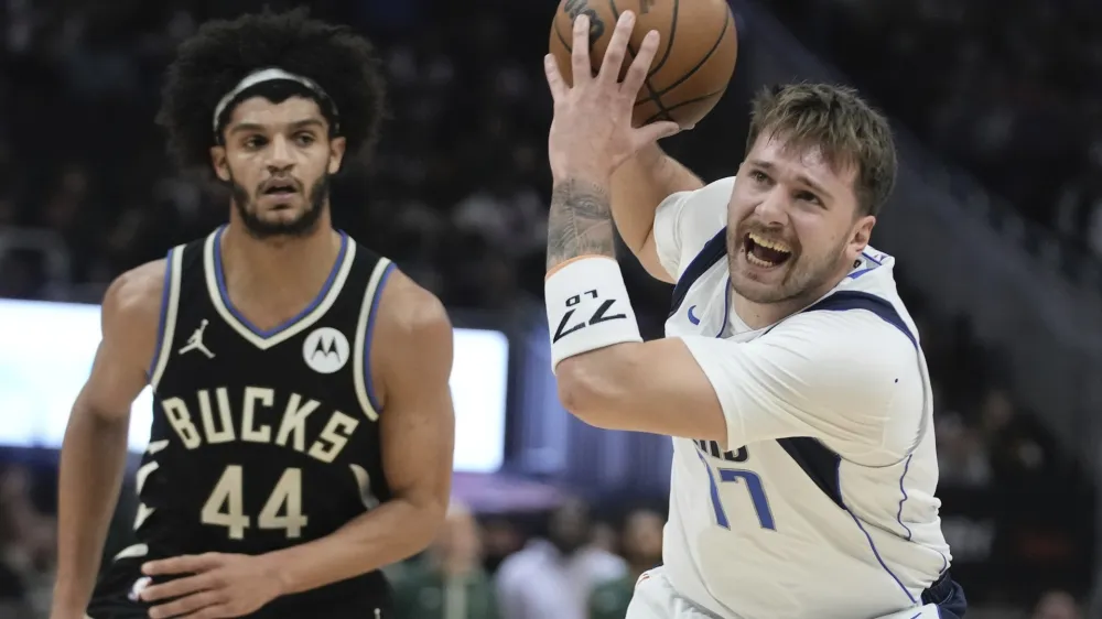 Dallas Mavericks' Luka Doncic gets past Milwaukee Bucks' Andre Jackson Jr. during the first half of an NBA basketball game Saturday, Nov. 18, 2023, in Milwaukee. (AP Photo/Morry Gash)