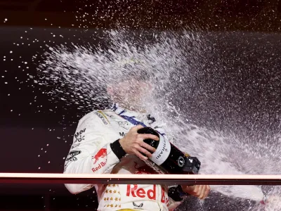 Formula One F1 - Las Vegas Grand Prix - Las Vegas Strip Circuit, Las Vegas, Nevada, U.S - November 18, 2023 First place Red Bull's Max Verstappen celebrates on the podium REUTERS/Mike Blake