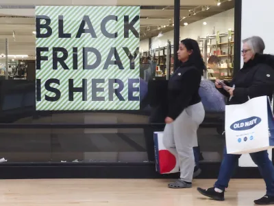 A "Black Friday" sign is posted at a retail location in Philadelphia, Monday, Nov. 21, 2022. Bargain hunting is back with full force heading into the holidays. But inflation is limiting how much of a deal consumers will be getting. (AP Photo/Matt Rourke)