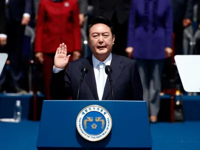 South Korean President Yoon Suk-yeol takes an oath during his inauguration in front of the National Assembly in Seoul, South Korea, May 10, 2022. Jeon Heon-Kyun /Pool via REUTERS