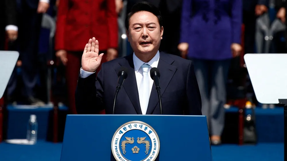 South Korean President Yoon Suk-yeol takes an oath during his inauguration in front of the National Assembly in Seoul, South Korea, May 10, 2022. Jeon Heon-Kyun /Pool via REUTERS