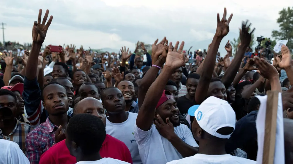 Supporters of political parties belonging to the Ensemble coalition cheer during Congolese presidential candidate's, Moise Katumbi's, campaign rally at the Afia stadium in Goma, North Kivu province, Democratic Republic of the Congo November 23, 2023. REUTERS/Arlette Bashizi