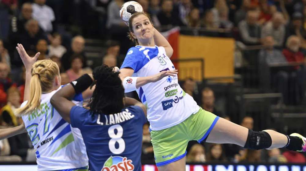 ﻿Slovenia's Ana Gros throws for goal against France's Laurisa Landre during the women's handball world championships match between France and Slovenia at Arena Trier in Trier, Germany, Saturday Dec. 2, 2017. (Harald Tittel/dpa via AP)