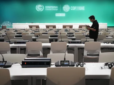 A worker sets up ahead of the COP28 U.N. Climate Summit, Wednesday, Nov. 29, 2023, in Dubai, United Arab Emirates. (AP Photo/Kamran Jebreili)