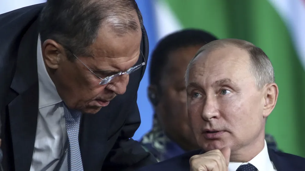 ﻿FILE - Russian President Vladimir Putin, right, listens to Russian Foreign Minister Sergey Lavrov, top, as Egyptian President Abdel Fattah el-Sisi sits next during a plenary session at the Russia-Africa summit in the Black Sea resort of Sochi, Russia, Oct. 24, 2019. In his role for nearly 18 years, Lavrov, 71, has seen relations with the West shift from near-friendly to openly hostile, plummeting to a catastrophic new low with the Russian war against Ukraine. The invasion prompted the European Union to freeze the assets of both Putin and Lavrov, among others â€" an unprecedented blow to Moscow's pride. (Valery Sharifulin, TASS News Agency Pool Photo via AP, File)