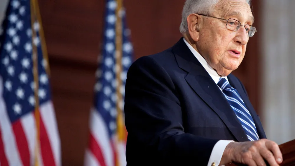 FILE PHOTO: Former U.S. Secretary of State Henry Kissinger speaks during a ceremony unveiling a statue of former U.S. President Gerald Ford in the Rotunda of the U.S. Capitol in Washington, U.S. May 3, 2011. REUTERS/Joshua Roberts/File Photo