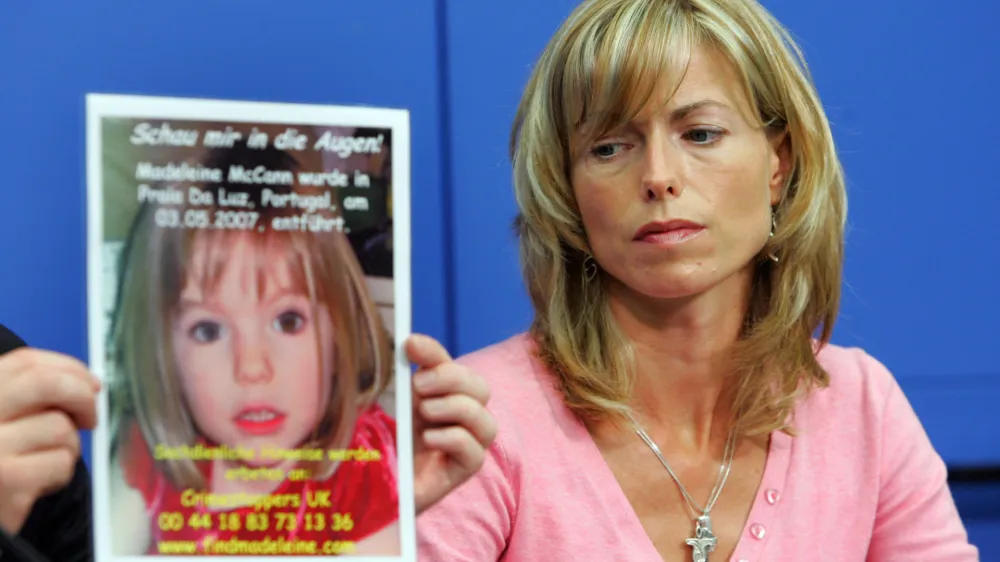 BERLIN - JUNE 06: Kate Mc Cann, the mother of the missing 4-year-old British girl Madeleine McCann looks at a poster showing her missing daughter during a press conference on June 6, 2007 in Berlin, Germany. Kate and her husband Gerry are in Berlin to spread the word in the search for their missing duaghter Madeleine who disappeared from their holiday apartment in Praia da Luz, Portugal on May 3, 2007. (Photo by Miguel Villagran/Getty Images)