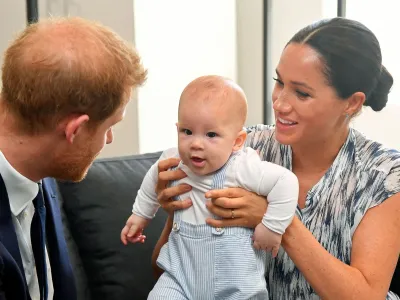 FILE PHOTO: Britain's Prince Harry and his wife Meghan, Duchess of Sussex, holding their son Archie, meet Archbishop Desmond Tutu (not pictured) at the Desmond & Leah Tutu Legacy Foundation in Cape Town, South Africa, September 25, 2019. REUTERS/Toby Melville/Pool/File Photo