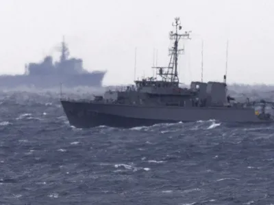 A Japanese Maritime Self Defense Force minesweeper searches in the waters where a U.S. military Osprey aircraft crashed, off Yakushima, Kagoshima prefecture, southern Japan, Friday, Dec. 1, 2023. Japan suspended flights by its Osprey aircraft Thursday, officials said, the day after the U.S. Air Force Osprey based in Japan crashed into the sea during a training mission. (Kyodo News via AP)