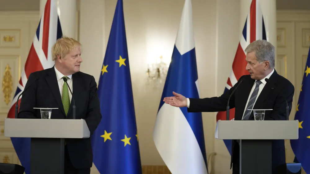 British Prime Minister Boris Johnson, left, and Finland's President Sauli Niinisto meet the media at the Presidential Palace in Helsinki, Finland, Wednesday, May 11, 2022. Britain has signed a security assurance with Sweden and its neighbor Finland, both pondering whether to join NATO following Russia's invasion of Ukraine, pledging to "bolster military ties" in the event of a crisis and support both countries should they come under attack. (AP Photo/Frank Augstein, Pool)