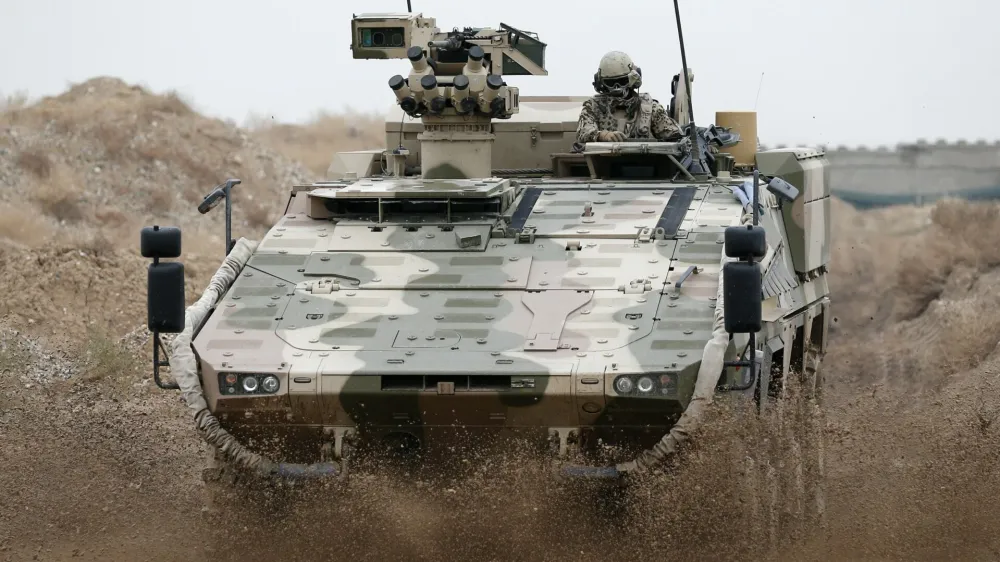 A German Bundeswehr army Boxer armoured personnel carrier drives at camp Marmal near Mazar-e-Sharif, northern Afghanistan December 17, 2012.   REUTERS/Fabrizio Bensch (AFGHANISTAN - Tags: MILITARY CONFLICT POLITICS) - GM1E8CH1D2I01