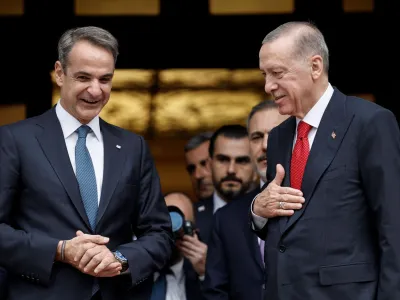 Greek Prime Minister Kyriakos Mitsotakis and Turkish President Tayyip Erdogan speak after their meeting at the Maximos Mansion in Athens, Greece, December 7, 2023. REUTERS/Louisa Gouliamaki