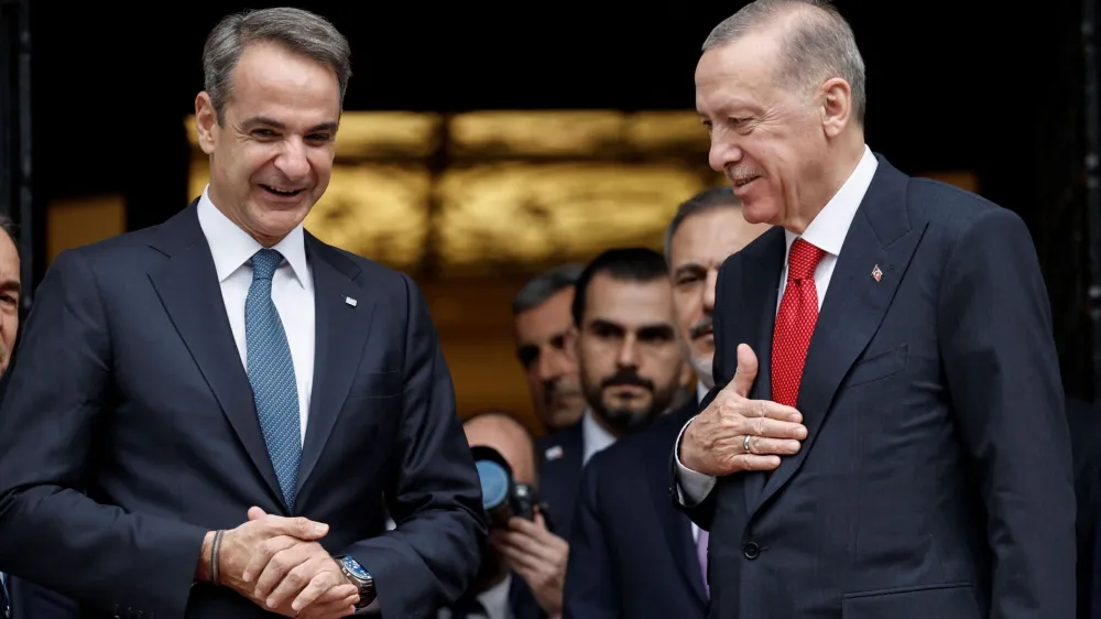 Greek Prime Minister Kyriakos Mitsotakis and Turkish President Tayyip Erdogan speak after their meeting at the Maximos Mansion in Athens, Greece, December 7, 2023. REUTERS/Louisa Gouliamaki