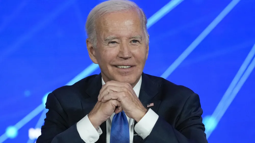 President Joe Biden smiles as members of the media leave the room and ask questions about his son Hunter Biden, during a discussion on managing the risks of Artificial Intelligence during an event in San Francisco, Tuesday, June 20, 2023. (AP Photo/Susan Walsh)