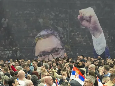 An image of Serbian President Aleksandar Vucic is seen during a pre-election rally of his ruling Serbian Progressive Party in Belgrade, Serbia, Saturday, Dec. 2, 2023. When Serbia formally opened membership negotiations with the European Union, back in 2014, it was a moment of hope for pro-Western Serbs, eager to set their troubled country on an irreversible path to democratization. Those days are long gone. Now, they feel betrayed, both by the government and the EU. (AP Photo/Darko Vojinovic)