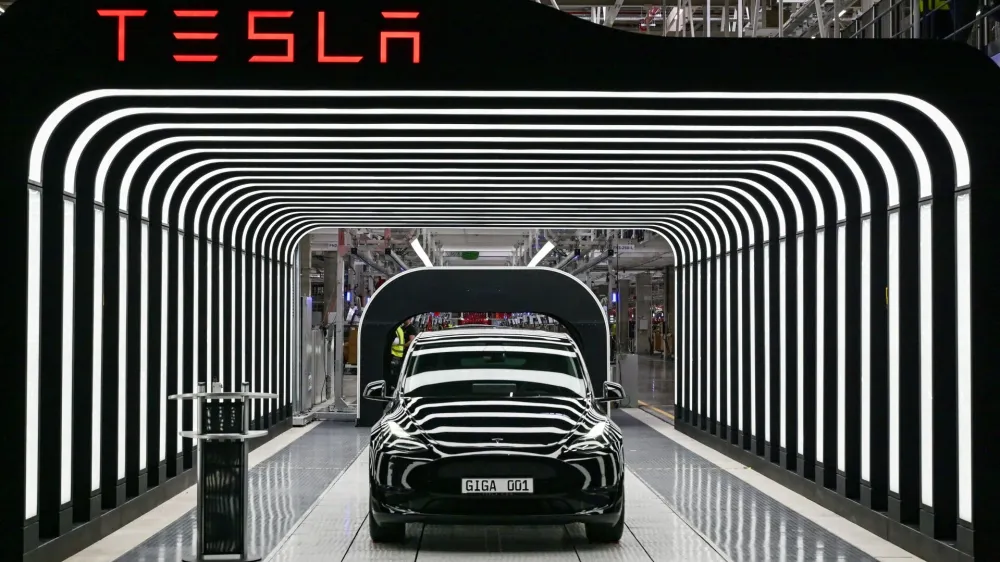 FILE PHOTO: Model Y cars are pictured during the opening ceremony of the new Tesla Gigafactory for electric cars in Gruenheide, Germany, March 22, 2022. Patrick Pleul/Pool via REUTERS/File Photo