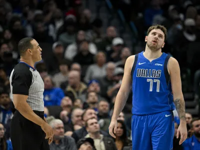 Dec 14, 2023; Dallas, Texas, USA; Dallas Mavericks guard Luka Doncic (77) argues a call with referee Curtis Blair (74) during the second half against the Minnesota Timberwolves at the American Airlines Center. Mandatory Credit: Jerome Miron-USA TODAY Sports