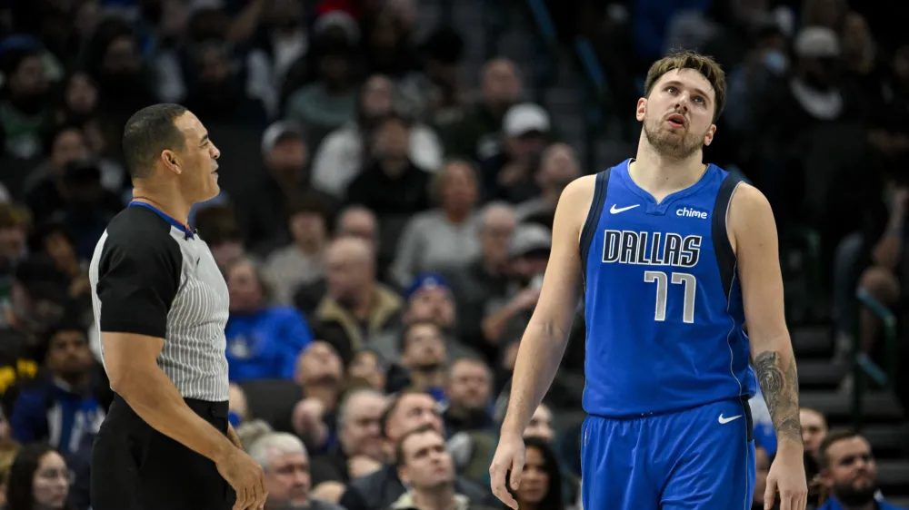 Dec 14, 2023; Dallas, Texas, USA; Dallas Mavericks guard Luka Doncic (77) argues a call with referee Curtis Blair (74) during the second half against the Minnesota Timberwolves at the American Airlines Center. Mandatory Credit: Jerome Miron-USA TODAY Sports