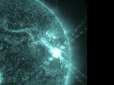 This photo provided by NASA's Solar Dynamics Observatory captured this image of a solar flare, as seen in the bright flash in the upper right, on Thursday, Dec. 14, 2023. The sun spit out the huge flare at noon on Thursday, resulting in two hours of radio interference in the U.S. and other sunlit parts of the world. (NASA via AP)