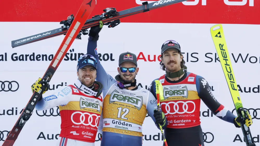 From left, second placed Norway's Aleksander Aamodt Kilde, the winner Italy's Dominik Paris and third placed United States' Bryce Bennett celebrate after an alpine ski, men's World Cup downhill race, in Val Gardena, Italy, Saturday, Dec. 16, 2023. (AP Photo/Alessandro Trovati)