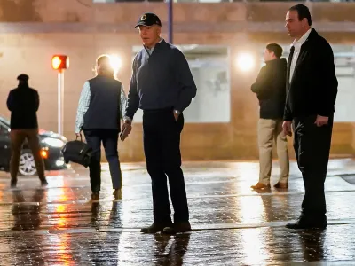 U.S. President Joe Biden reacts to questions by reporters as he exits his campaign headquarters, in Wilmington, Delaware, U.S. December 17, 2023. REUTERS/Nathan Howard REFILE - CHANGING FROM "REACTS AFTER A VEHICLE CRASHED INTO A SECRET SERVICE SUV" TO "REACTS TO QUESTIONS BY REPORTERS" AND CORRECTING LOCATION FROM "NORTH CAROLINA" TO "DELAWARE\