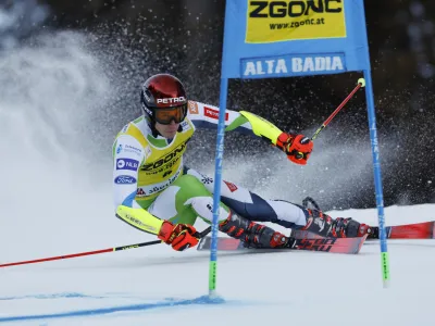 Slovenia's Zan Kranjec speeds down the course during the first run of an alpine ski, men's World Cup giant slalom race, in Alta Badia, Italy, Monday, Dec. 18, 2023. (AP Photo/Alessandro Trovati)