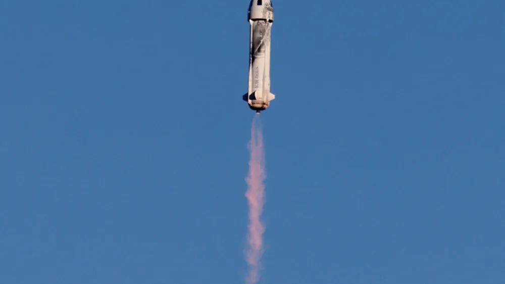 FILE PHOTO: A Blue Origin New Shepard rocket lifts off with a crew of six from Launch Site One in west Texas, U.S. December 11, 2021. REUTERS/Joe Skipper/File Photo