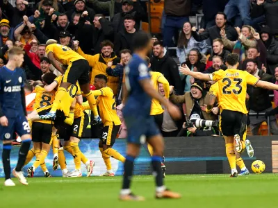 24 December 2023, United Kingdom, Wolverhampton: Wolverhampton Wanderers' Matt Doherty (hidden) celebrates scoring his side's second goal of the game with team-mates during the English Premier League soccer match between Wolverhampton and Chelsea at Molineux Stadium. Photo: Jacob King/PA Wire/dpa