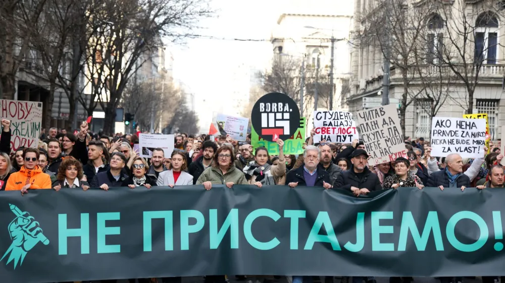 People carry a banner reading 'We don't agree' during a protest organised by ProGlas, the Serbian pro-democracy movement, amid opposition claims of major election law violations in the Belgrade city and parliament races, in Belgrade, Serbia, December 30, 2023. REUTERS/Zorana Jevtic