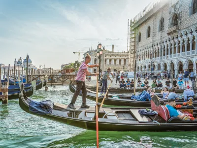 Venice, Italy - May 29 2023: Traditional gondola ride on the Grand Canal.Tourists in Venice.