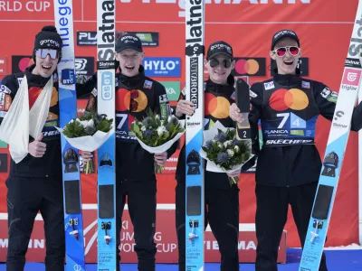 Slovenian team celebrate their second place at the Ski Jumping World Cup team competition in Planica, Slovenia, Saturday, March 23, 2024. (AP Photo/Darko Bandic)